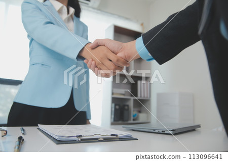 Close up view of job interview in office, focus on resume writing tips, employer reviewing good cv of prepared skilled applicant, recruiter considering application, hr manager making hiring decision Close up view of job interview in office, focus on resume writing tips, employer reviewing good cv of prepared skilled applicant, recruiter considering application, hr manager making hiring decision 113096641