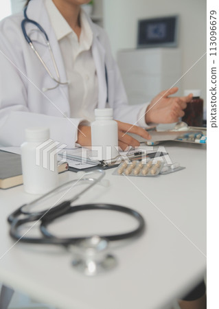 Healthcare service and pharmacy worker with customer at store counter for medication explanation. Pharmaceutical advice and opinion of pharmacist helping girl with medicine information. 113096679