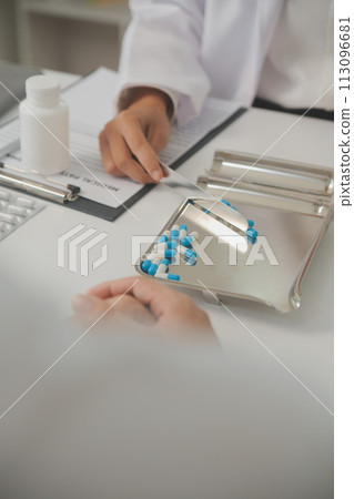 Healthcare service and pharmacy worker with customer at store counter for medication explanation. Pharmaceutical advice and opinion of pharmacist helping girl with medicine information. 113096681