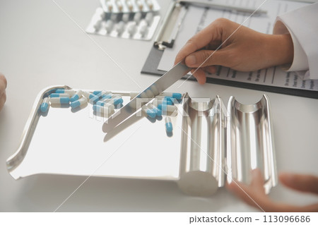 Healthcare service and pharmacy worker with customer at store counter for medication explanation. Pharmaceutical advice and opinion of pharmacist helping girl with medicine information. 113096686