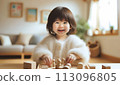 Girl playing with wooden toys 2 113096805