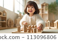 Girl playing with wooden toys 1 113096806