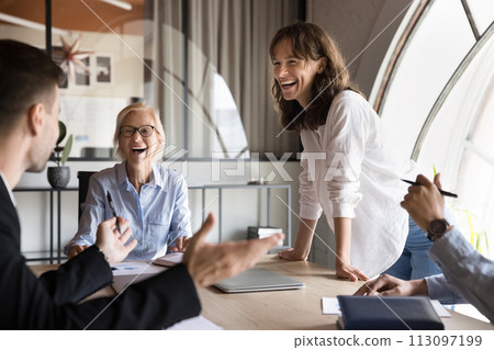 Happy young diverse business colleagues having fun at corporate meeting Happy young diverse business colleagues having fun at corporate meeting 113097199