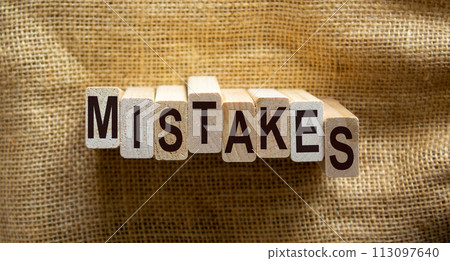Concept word 'mistakes' on wooden blocks on a beautiful canvas background. Business concept. 113097640
