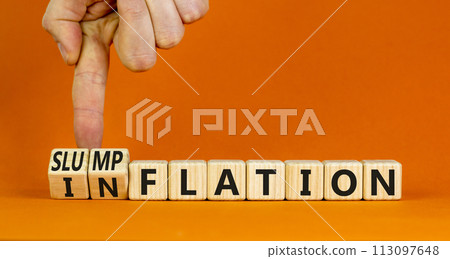 Inflation or slumpflation symbol. Concept word Inflation Slumpflation on beautiful wooden cubes. Beautiful orange background. Businessman hand. Business inflation slumpflation concept. Copy space. 113097648