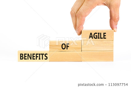 Benefits of agile symbol. Concept words Benefits of agile on beautiful wooden blocks. Beautiful white table white background. Businessman hand. Business benefits of agile concept. Copy space. 113097754
