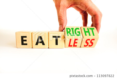 Eat less or right symbol. Concept words Eat less or Eat right on wooden cubes. Beautiful white table white background. Doctor hand. Healthy lifestyle and eat less or right concept. Copy space. 113097822