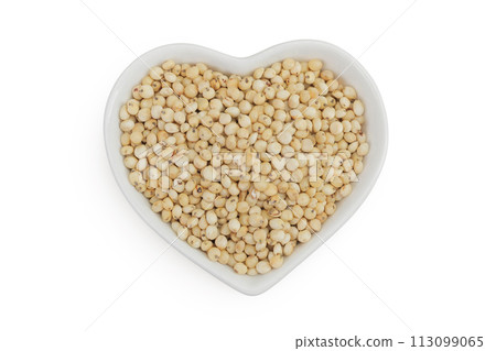 Sorghum seeds in ceramic bowl isolated on white background. Top view. Flat lay. 113099065