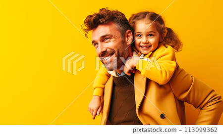 a little daughter warmly embraces her father on a vibrant yellow background 113099362