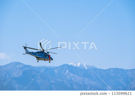 A helicopter heading to the Northern Alps [Photo taken from Shinshu Sky Park] 113099621