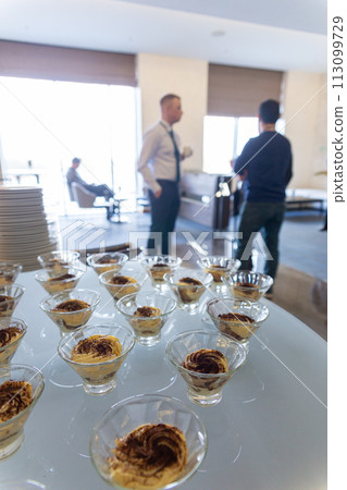 Vases with pudding at a banquet 113099729