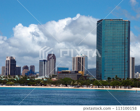 Ala Moana Beach Park with office building and condos in the background 113100158