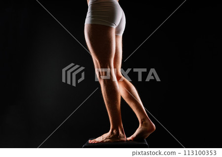 Male muscular legs body-building, muscle man in white sport panties 113100353