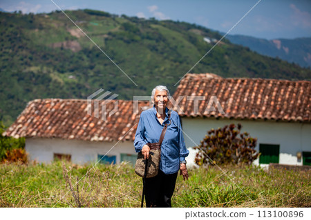 Senior woman tourist at the beautiful heritage town of Salamina in the department of Caldas in Colombia 113100896