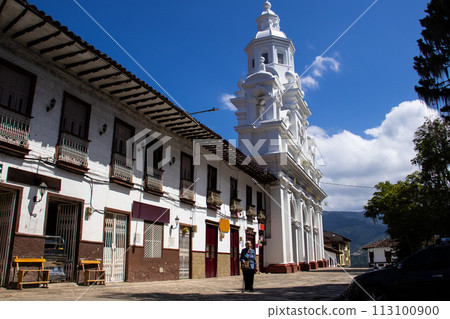 Senior woman tourist at the beautiful heritage town of Salamina in the department of Caldas in Colombia 113100900