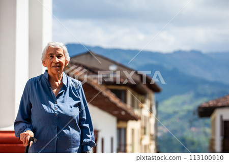 Senior woman tourist at the beautiful heritage town of Salamina in the department of Caldas in Colombia 113100910
