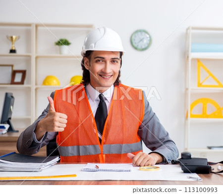 Young male architect working in the office 113100993