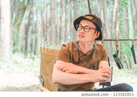 Campers suffering from large numbers of insects while camping Campers suffering from large numbers of insects while camping 113102853