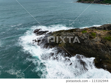 Amazing tropical seashore landscape background,Top view waves crashing on rocks Amazing tropical seashore landscape background,Top view waves crashing on rocks 113102944