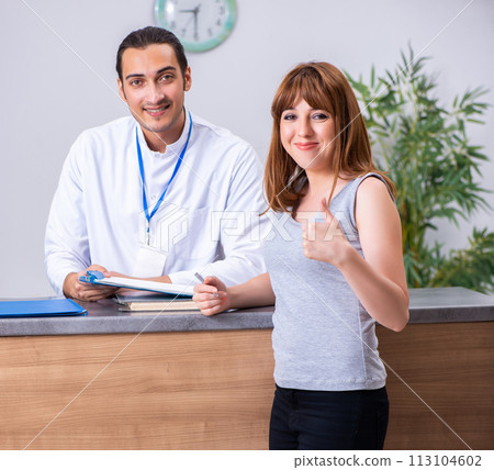 Young patient at the reception in the hospital 113104602