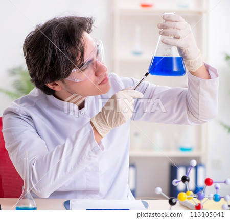 Young male biochemist working in the lab Young male biochemist working in the lab 113105041