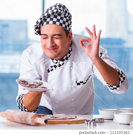 Young man cooking cookies in kitchen Young man cooking cookies in kitchen 113105361