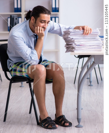 Young male employee in travel preparation concept Young male employee in travel preparation concept 113105445