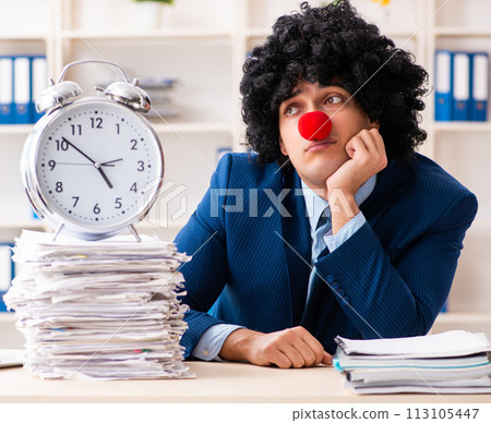 Young clown businessman working in the office Young clown businessman working in the office 113105447