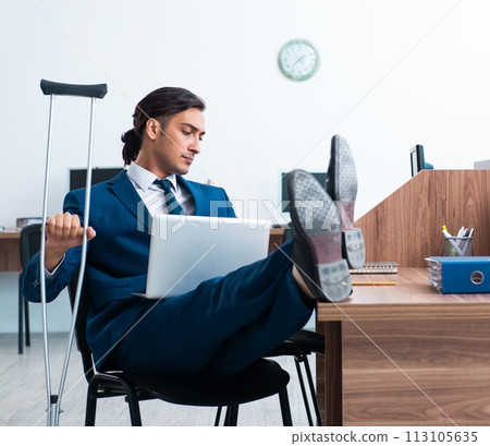 Young leg injured employee in the office Young leg injured employee in the office 113105635