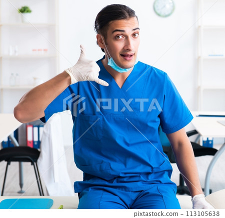 Young male doctor working in the clinic Young male doctor working in the clinic 113105638