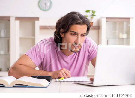 Young male student preparing for exams at home Young male student preparing for exams at home 113105703