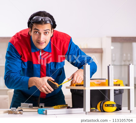 Young contractor repairing furniture at home Young contractor repairing furniture at home 113105704