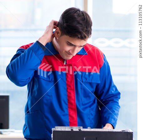 Computer repairman specialist repairing computer desktop 113105762