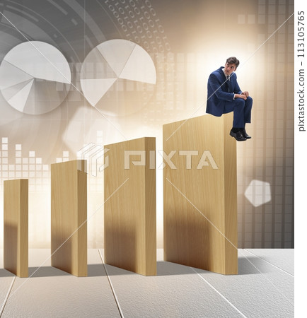 Businessman in domino effect concept 113105765