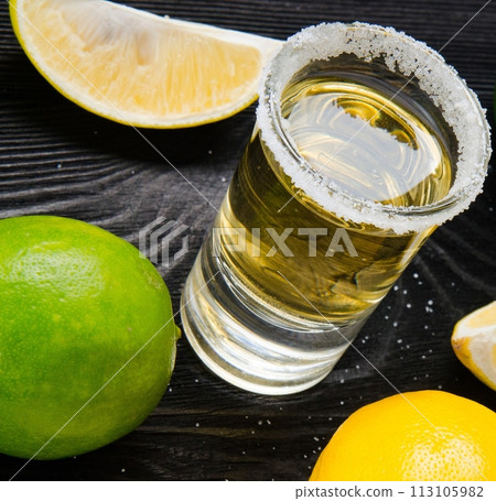 Tequila drink served in glasses with lime and salt Tequila drink served in glasses with lime and salt 113105982