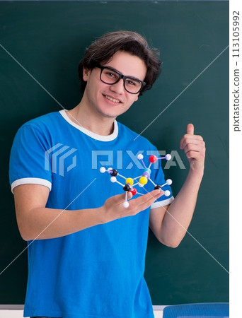 Young male student in the classroom Young male student in the classroom 113105992