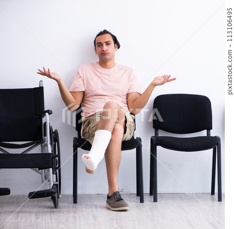 Young injured man waiting for his turn in hospital hall 113106495