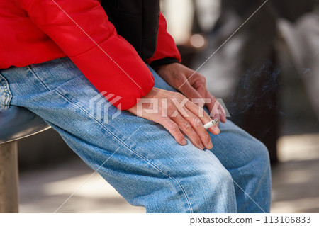 Smoker smoking in a smoking area Smoker smoking in a smoking area 113106833