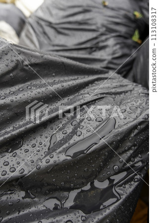 Detail of wet garbage bags on a cold rainy day Detail of wet garbage bags on a cold rainy day 113108317