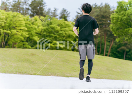 Young man walking/jogging/running/exercising/aerobic exercise/training in the park Young man walking/jogging/running/exercising/aerobic exercise/training in the park 113109207