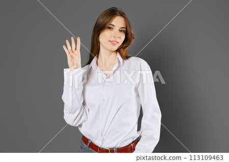 Cute woman shows four fingers 113109463