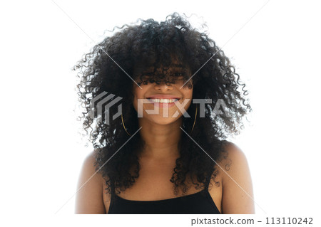 A full-front portrait of a young woman with frizzy hair A full-front portrait of a young woman with frizzy hair 113110242