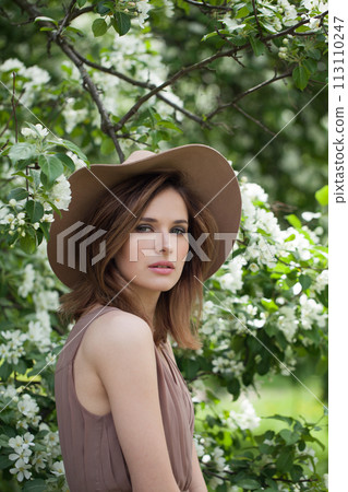 Carefree lady female model in spring leaves background 113110247