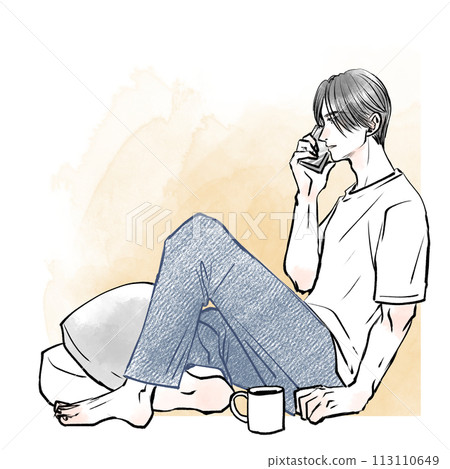 A man sitting on the floor and talking on a smartphone 113110649