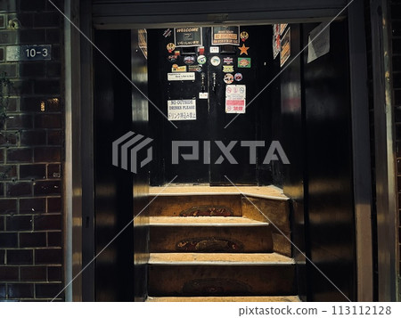 The entrance to the long-established live music bar JET. Okinawan lock. Night on Koza Gate Street, Okinawa. The entrance to the long-established live music bar JET. Okinawan lock. Night on Koza Gate Street, Okinawa. 113112128