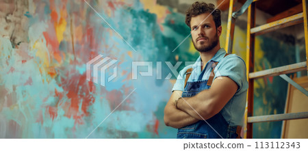 Labor Day banner concept with copy space, young handyman standing with arms crossed and looking at smiling camera Labor Day banner concept with copy space, young handyman standing with arms crossed and looking at smiling camera 113112343