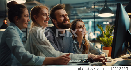 Portrait of colleagues looking at the monitor and rejoicing at the success achieved and teamwork in the company, achieving their goals 113112395