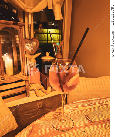 Refreshing alcoholic claRefreshing alcoholic classic aperol sprits cocktail with ice and rosemary on the window sillssic aperol sprits cocktail with ice and rosemary on the window sill Refreshing alcoholic claRefreshing alcoholic classic aperol sprits cocktail with ice and rosemary on the window sillssic aperol sprits cocktail with ice and rosemary on the window sill 113112799