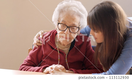 Granddaughter cheers up her sad grandmother in a nursing home Granddaughter cheers up her sad grandmother in a nursing home 113112930