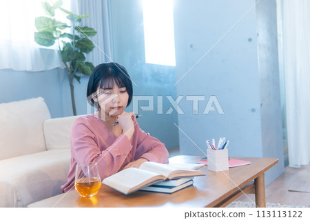 Women studying at home/reading/reskilling 113113122